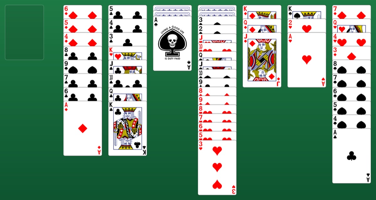 A game of Scorpion Solitaire in progress: seven columns of cards on green felt, several already built down in suit.